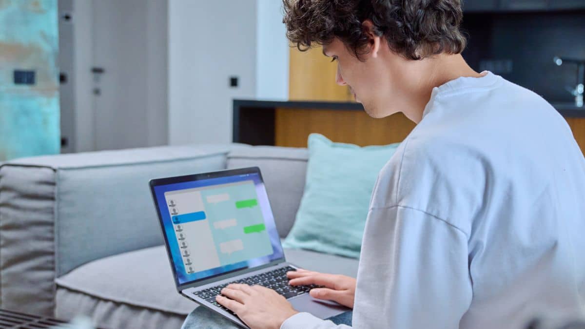 Boy typing on laptop